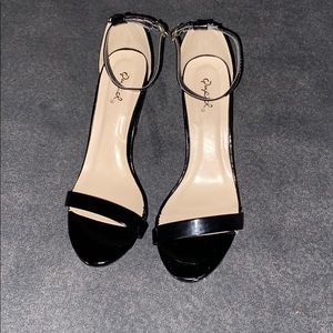 Patent leather black peep toe women’s high heels.